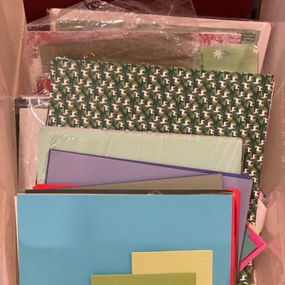 Tote with miscellaneous crafting paper and photo albums