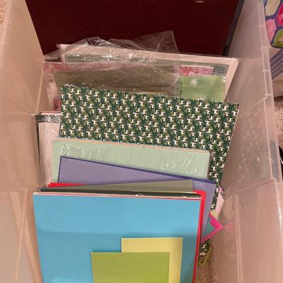 Tote with miscellaneous crafting paper and photo albums