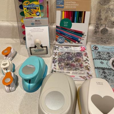 Color pencils, paint, brushes and cutouts