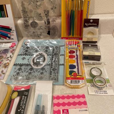 Color pencils, paint, brushes and cutouts