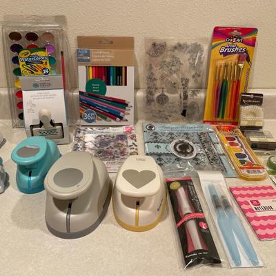 Color pencils, paint, brushes and cutouts