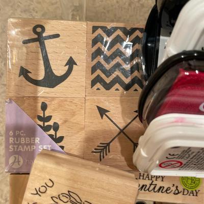 Many wood stamps in clear plastic tote