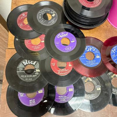 Sale Photo Thumbnail #22: The records are in fair to good condition, there might be signs of wear including scratches, but nothing too deep.  The previous owner has labeled the records with a number system. The case is easy to use, just cover, twist and carry.