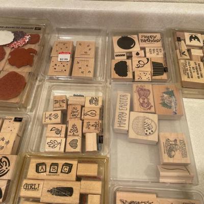 Wood stamps in plastic containers