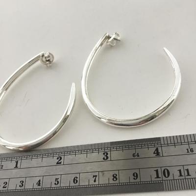 Silver tone hoop earrings