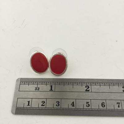 Red oval silver tone stud earrings