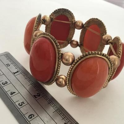 Gold tone red and orange stretchy fashion bracelet