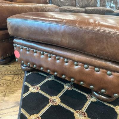 Sale Photo Thumbnail #15: Cognac colored leather club chair with matching ottoman by Henredon. 
Chair measurements: 37"H x 36" wide.
Chair and ottoman only, does not include rug or anything else in pictures.