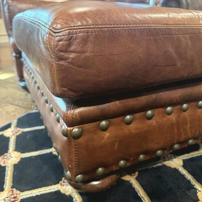 Sale Photo Thumbnail #17: Cognac colored leather club chair with matching ottoman by Henredon. 
Chair measurements: 37"H x 36" wide.
Chair and ottoman only, does not include rug or anything else in pictures.