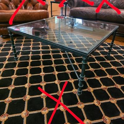 Sale Photo Thumbnail #25: Large dark green iron base with glass top coffee table and matching end table.  Tables only. Does not include rug or anything else in pictures. 

Coffee table measurements: 36" X 36" x16"H

Side table measurements: 20"×20"