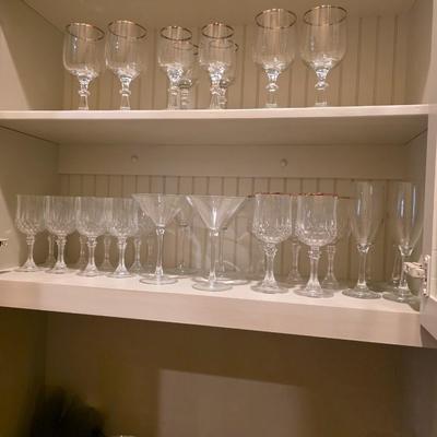 Sale Photo Thumbnail #37: Lot of glassware: 12 wine, 5 gold rim, 4 Martini, 4 large silver rim,  4 small silver rim, 4 champagne,  Mexican glass blue rim pitcher with 2 matching margarita glasses, 3 green stem margarita glasses, 4 Lingchamp wine in box,  3 small green stem.