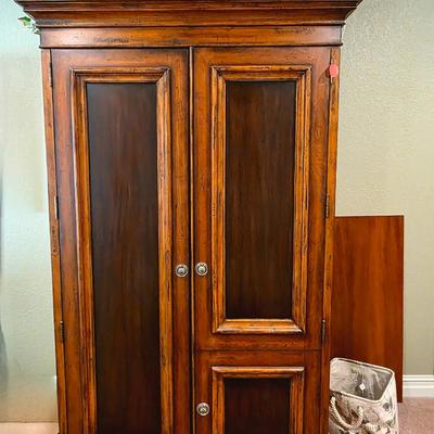 Sale Photo Thumbnail #45: Contemporary armoire with greenery and decorative floral box.  

Measurements: 79.5"H x 46"W