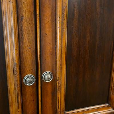 Sale Photo Thumbnail #48: Contemporary armoire with greenery and decorative floral box.  

Measurements: 79.5"H x 46"W