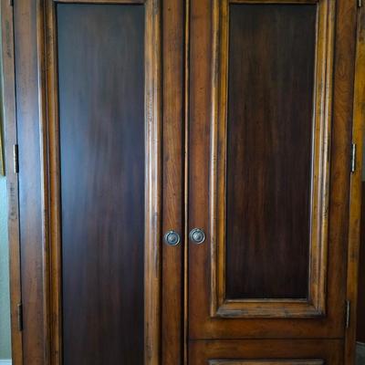 Sale Photo Thumbnail #47: Contemporary armoire with greenery and decorative floral box.  

Measurements: 79.5"H x 46"W