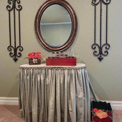 Sale Photo Thumbnail #53: Bean shape table with green fabric skirt, 2 wrought iron wall hangings,  1 oval mirror, pink floral, and vintage bottles.

Table: 34L x 17D × 29H 
Wrought Iron wall hangings: 45" 
Oval mirror: 33"×37"