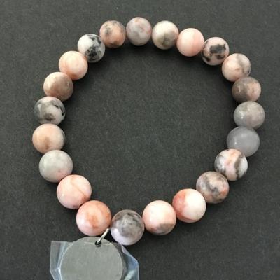 Beautiful pink and gray stone bead stretch bracelet with adventures begin charm