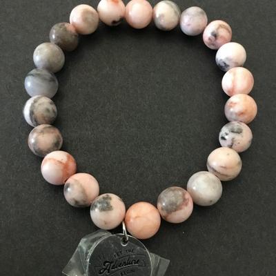 Beautiful pink and gray stone bead stretch bracelet with adventures begin charm