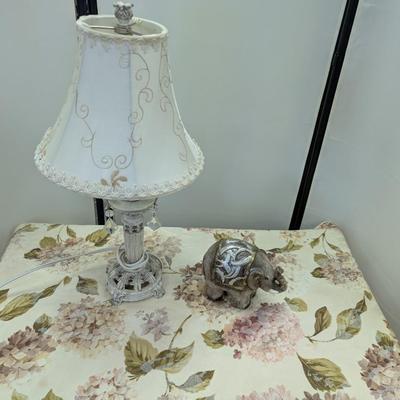 Sale Photo Thumbnail #77: Small white metal lamp with elephant.