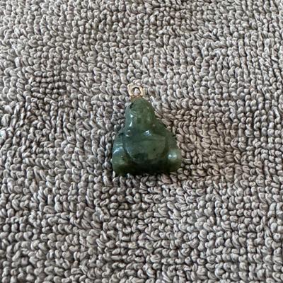 Jade Buddha Pendant. cherished symbol of wealth and well-being.
