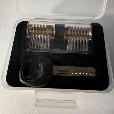 Transparent dimple practice lock set, commonly used for learning and practicing lock picking techniques.