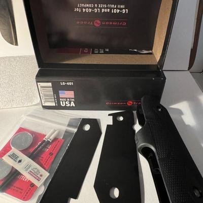 CRIMSON TRACE LG-401 LaserGrips, a laser sight specifically designed for 1911 Full-Size pistols.