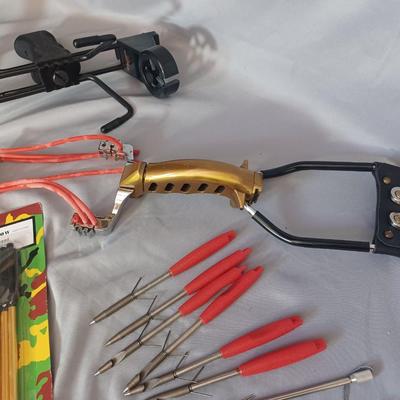 Sale Photo Thumbnail #72: 2 sling shots with 33 arrows and extra bungee.
