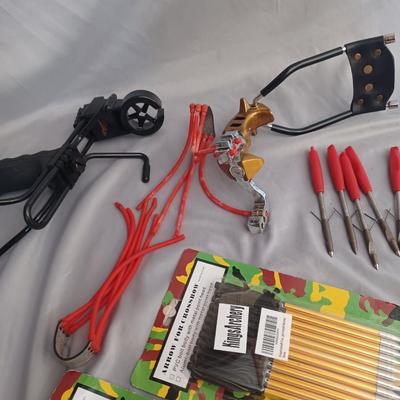 Sale Photo Thumbnail #73: 2 sling shots with 33 arrows and extra bungee.