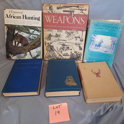 Sale Photo Thumbnail #100: Vintage Books: owned by Fred Bear:
 A Treasury of African Hunting by Peter Barrett 
Weapons by Edwin Tunis 
Triggernometry by Eugene Cunnigham Ed McGiverns Book on Fast and Fancy Revolver shooting 
Hell on Ice by Commander Edward Ellsbeeg 
Shots at Whitet