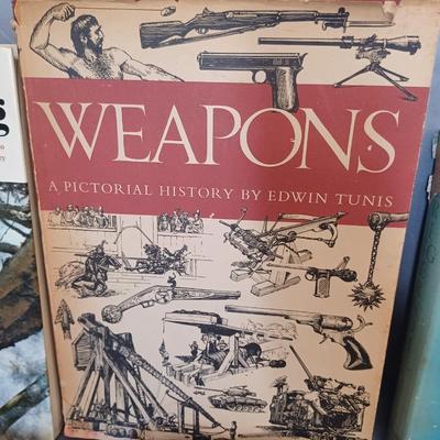 Sale Photo Thumbnail #104: Vintage Books: owned by Fred Bear:
 A Treasury of African Hunting by Peter Barrett 
Weapons by Edwin Tunis 
Triggernometry by Eugene Cunnigham Ed McGiverns Book on Fast and Fancy Revolver shooting 
Hell on Ice by Commander Edward Ellsbeeg 
Shots at Whitet