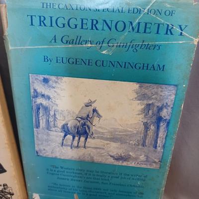 Sale Photo Thumbnail #106: Vintage Books: owned by Fred Bear:
 A Treasury of African Hunting by Peter Barrett 
Weapons by Edwin Tunis 
Triggernometry by Eugene Cunnigham Ed McGiverns Book on Fast and Fancy Revolver shooting 
Hell on Ice by Commander Edward Ellsbeeg 
Shots at Whitet