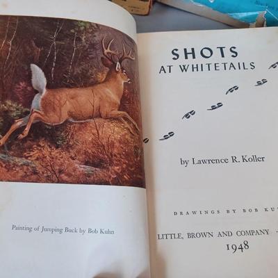 Sale Photo Thumbnail #107: Vintage Books: owned by Fred Bear:
 A Treasury of African Hunting by Peter Barrett 
Weapons by Edwin Tunis 
Triggernometry by Eugene Cunnigham Ed McGiverns Book on Fast and Fancy Revolver shooting 
Hell on Ice by Commander Edward Ellsbeeg 
Shots at Whitet