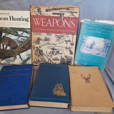 Sale Photo Thumbnail #117: Vintage Books: owned by Fred Bear:
 A Treasury of African Hunting by Peter Barrett 
Weapons by Edwin Tunis 
Triggernometry by Eugene Cunnigham Ed McGiverns Book on Fast and Fancy Revolver shooting 
Hell on Ice by Commander Edward Ellsbeeg 
Shots at Whitet