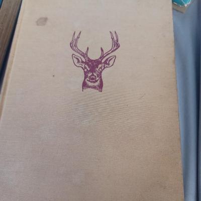 Sale Photo Thumbnail #109: Vintage Books: owned by Fred Bear:
 A Treasury of African Hunting by Peter Barrett 
Weapons by Edwin Tunis 
Triggernometry by Eugene Cunnigham Ed McGiverns Book on Fast and Fancy Revolver shooting 
Hell on Ice by Commander Edward Ellsbeeg 
Shots at Whitet