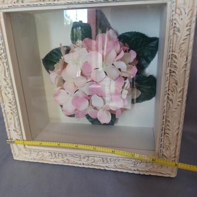 Sale Photo Thumbnail #144: 2-shadow box picture frames with flowers inside. One is white and the other 
is off-white.