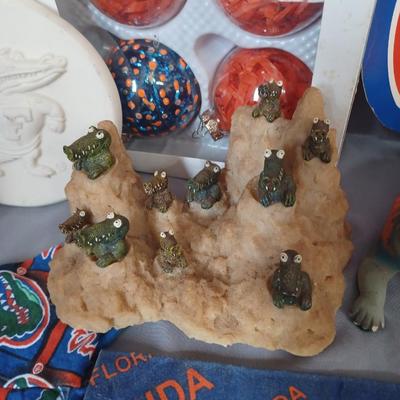 Sale Photo Thumbnail #158: Gator items. Ornaments, dog clothes, mugs, decor. 18 items