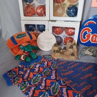 Sale Photo Thumbnail #159: Gator items. Ornaments, dog clothes, mugs, decor. 18 items