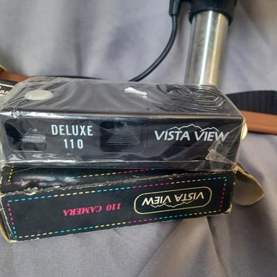 Sale Photo Thumbnail #173: Cameras and 2 bags. Minolta Maxxum 5000 with Promatuc flas, Petri FT, Vista view deluxe 110 camera, and Vintage Heiland flash and lens
