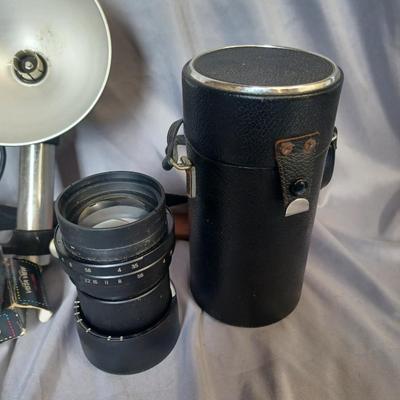 Sale Photo Thumbnail #167: Cameras and 2 bags. Minolta Maxxum 5000 with Promatuc flas, Petri FT, Vista view deluxe 110 camera, and Vintage Heiland flash and lens