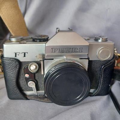 Sale Photo Thumbnail #171: Cameras and 2 bags. Minolta Maxxum 5000 with Promatuc flas, Petri FT, Vista view deluxe 110 camera, and Vintage Heiland flash and lens