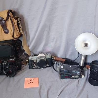 Sale Photo Thumbnail #166: Cameras and 2 bags. Minolta Maxxum 5000 with Promatuc flas, Petri FT, Vista view deluxe 110 camera, and Vintage Heiland flash and lens
