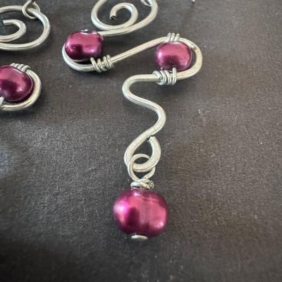 Dark Pink Glass Pearl Twisted Drop Earrings, characterized by their handmade, wire-wrapped design.