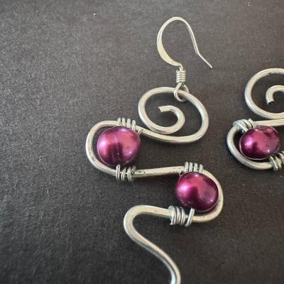 Dark Pink Glass Pearl Twisted Drop Earrings, characterized by their handmade, wire-wrapped design.