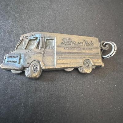 Snap-on Tools truck-shaped keychain, made of solid brass.