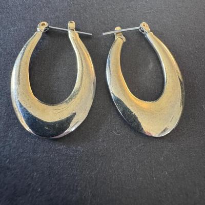 Vintage-style, elongated, or oval hoop earrings.