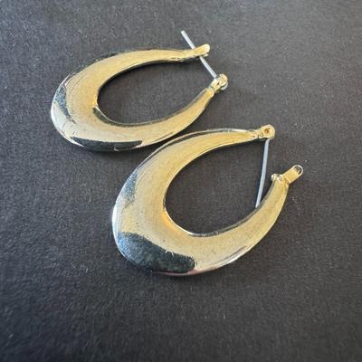 Vintage-style, elongated, or oval hoop earrings.