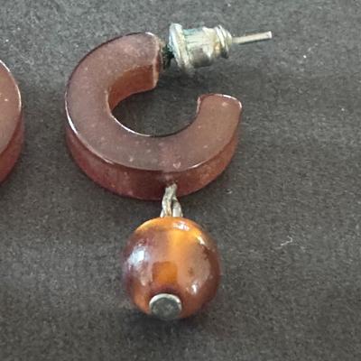 CHLOE Hoops in Amber, a style of earring featuring chunky, C-shaped hoops in a warm, amber color,