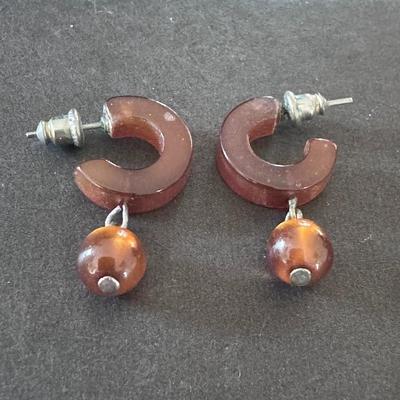 CHLOE Hoops in Amber, a style of earring featuring chunky, C-shaped hoops in a warm, amber color,