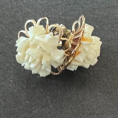 Vintage carved flower earrings , likely from the mid-20th century.