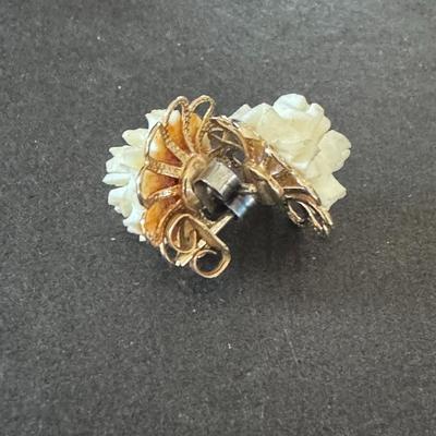 Vintage carved flower earrings , likely from the mid-20th century.