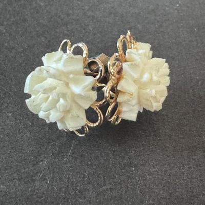 Vintage carved flower earrings , likely from the mid-20th century.